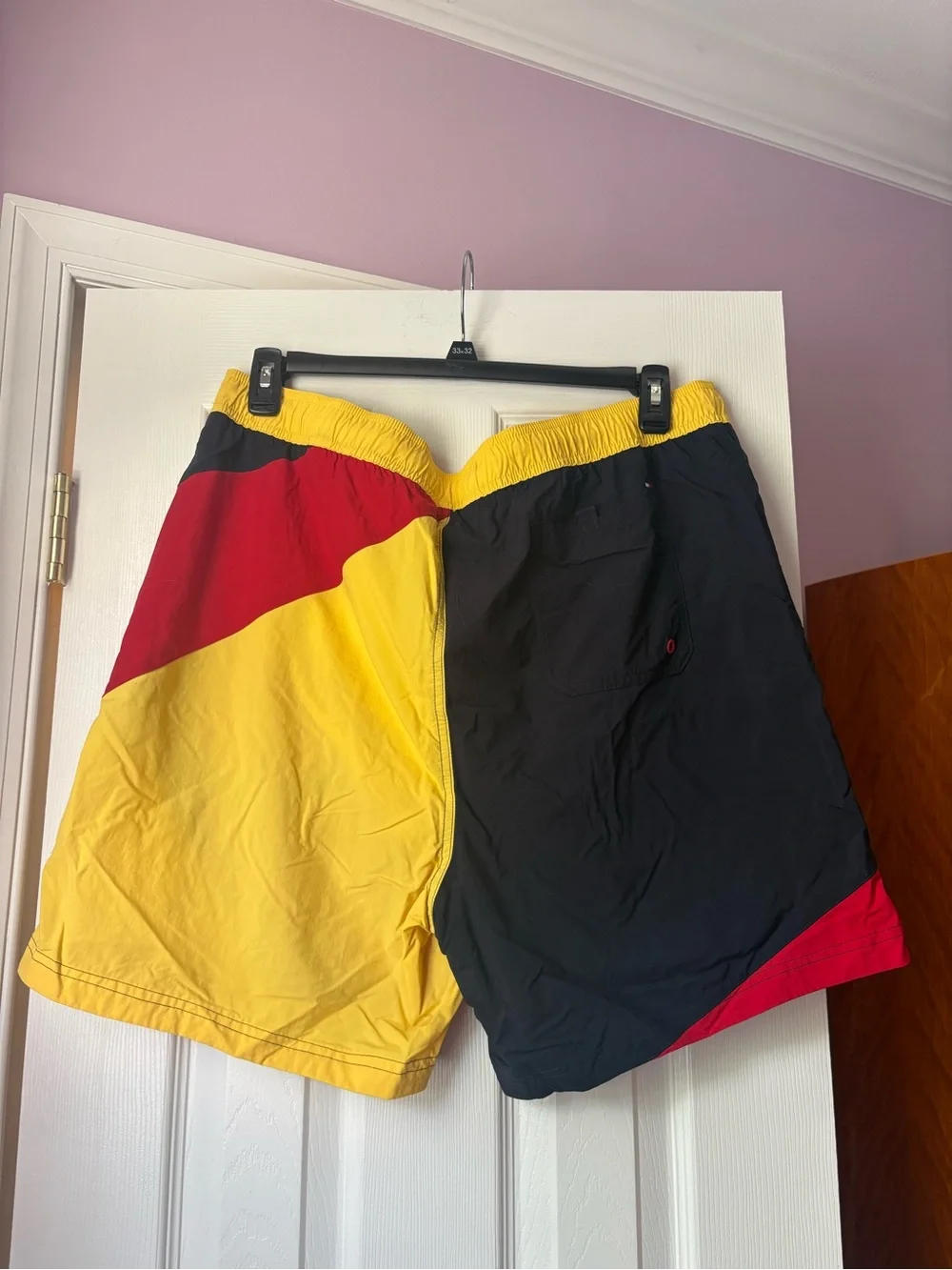 Tommy Hilfiger Men’s Colorblock Swim Trunks in Red, Black & Yellow